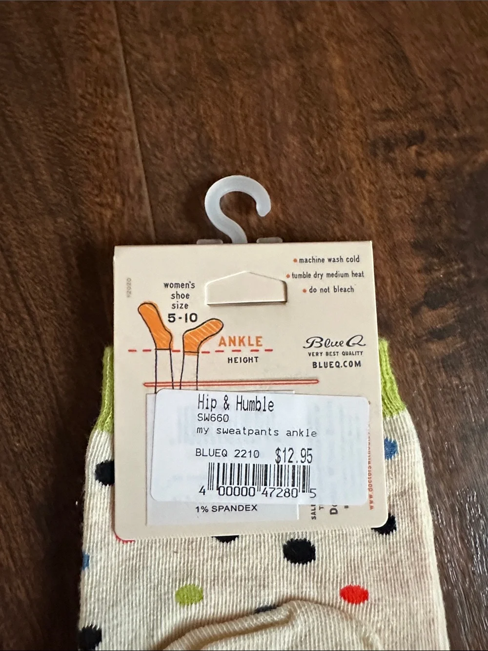 Blue Q Cream Crew Socks with Red Text and Blue & Green Graphic